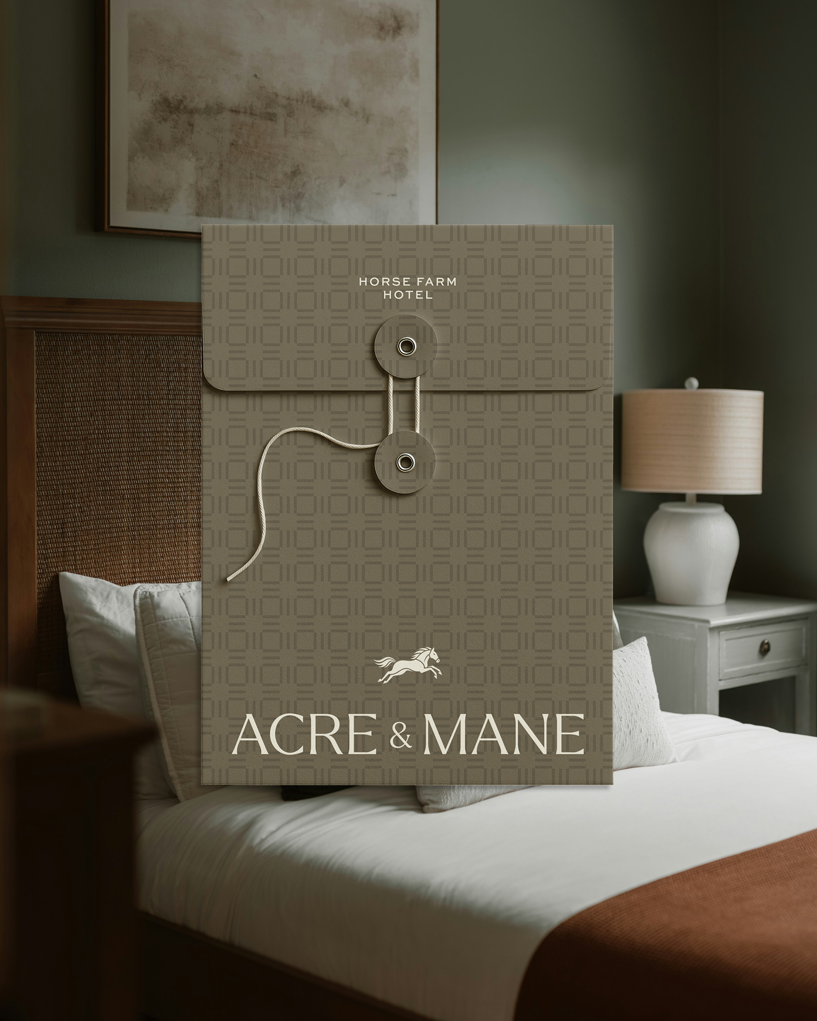 Acre & Mane branded hotel envelope displayed on hotel room background